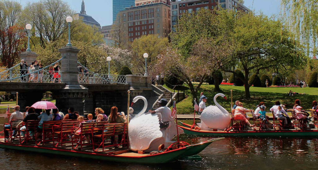 Visitors on a boat at the Swan Boats park in Boston 